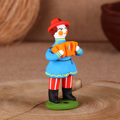 Дымковская игрушка «Фигурка: Мужик стоячий с гармошкой»