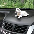 Собака на панель авто, качающая головой, большая, белый окрас - фото 9823556