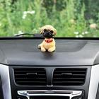 Собака на панель авто, качающая головой, дог - фото 6317089