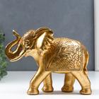 Сувенир полистоун "Слон с пальмовыми листьями на попоне" золотой 16,7х8х20,2 см - фото 2958459