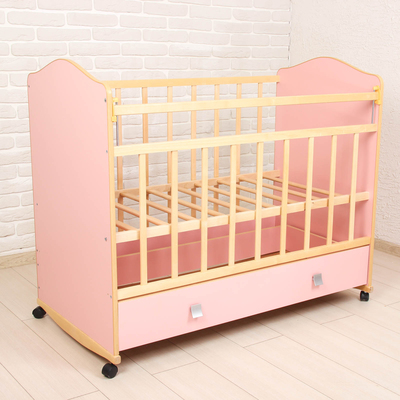 Детская кроватка «Морозко» на колёсах или качалке, с ящиком, цвет розовый