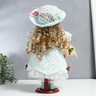 Кукла коллекционная керамика "Люси в голубом платье, шляпке и с цветами" 30 см - фото 6579043