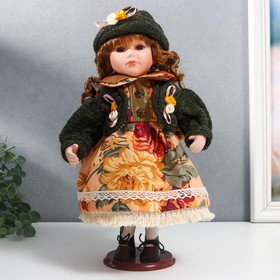 Кукла коллекционная керамика 'Алёна в платье с цветами, в зелёной шапке и джемпере' 30 см