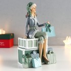 Сувенир полистоун "Девушка в костюме санты на горе подарков" 18х7,5х11 см - фото 21757085