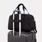 Сумка спортивная на молнии, наружный карман, держатель для чемодана, цвет чёрный - фото 24736039