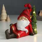 Сувенир полистоун свет "Дед Мороз в красном наряде сидит у ёлочки" 14х7х18 см